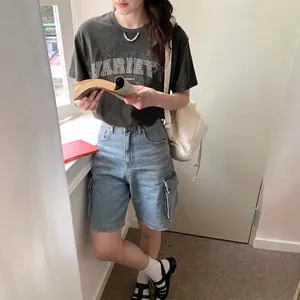 Women's vintage blue multi-pocket denim cargo shorts with loose wide-leg fit for summer