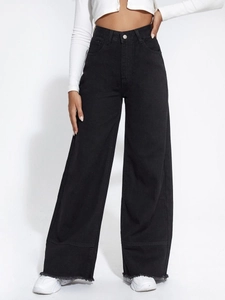 Detail shot of high-waisted black wide-leg jeans with raw hem and loose fit for women