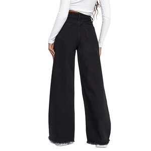 Detail of high waisted wide leg jeans in dark grey with raw fringe hem and back pockets