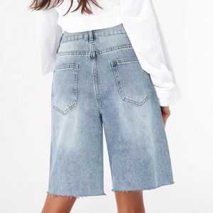 Women's vintage light blue denim Bermuda shorts with raw hem and back pockets view