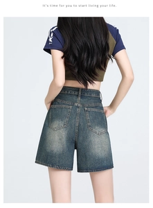 Rear view of high waist denim shorts in vintage dark blue wash with standard back pockets