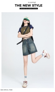 High waist retro blue denim shorts with a vintage wash and casual wide-leg cut for women