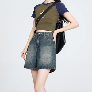 Retro high-waisted A-line denim shorts with vintage wash and streetwear style