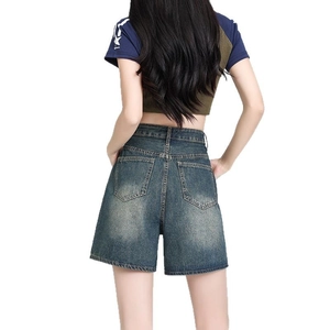 High-waisted wide-leg denim shorts in vintage dark wash shown from a back view