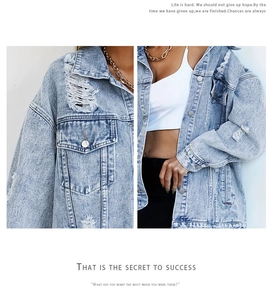Detail of distressed light blue denim jacket featuring ripped texture and metal buttons