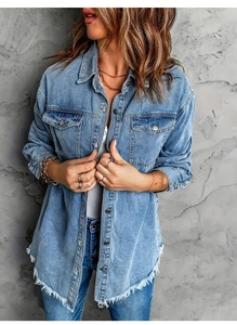 Close-up of light blue denim shirt jacket featuring raw edges and metallic buttons
