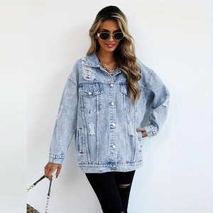 Classic light blue oversized distressed denim jacket with ripped details and metal buttons