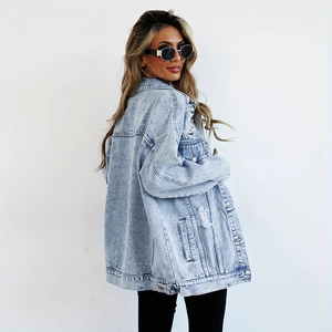 Oversized long light blue denim jacket for women with distressed ripped details and drop shoulders