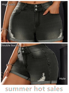 Detail showing high-waisted double buckle design and distressed holes on charcoal denim shorts