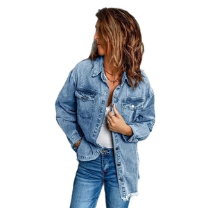 Oversized light blue wash denim shirt jacket with frayed hem and classic double chest pockets