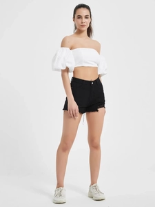 Women's white off-shoulder puff sleeve crop top with black distressed high waist denim shorts