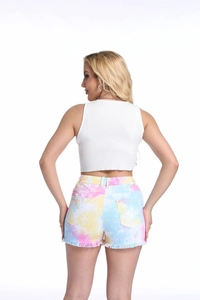 Detail of colorful tie-dye denim shorts with frayed edges and slim fit back view