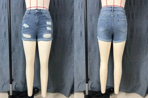 Detailed front and back view of distressed denim shorts with ripped details and rolled hems