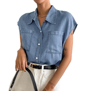 Women denim button-down short sleeve shirt with large chest pockets in a relaxed fit