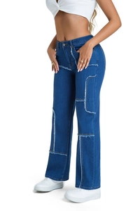Detail view of high waist denim jeans featuring unique patchwork and raw fringe hem design