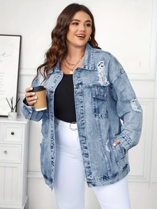 Close-up of distressed light blue denim jacket featuring vintage ripped details and metal buttons