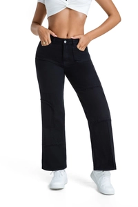 Detailed view of high-waist black patchwork jeans with frayed edges and straight leg cut
