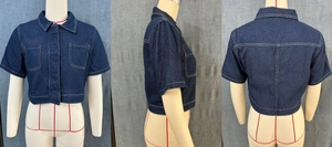 Three-way view of a short-sleeved dark blue denim jacket with flap pockets and lapel collar