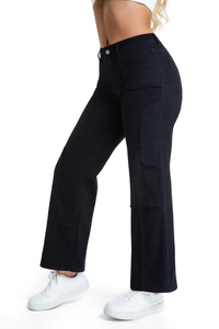 Detail of black patchwork denim jeans with raw edges and high waist fit on a model