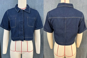 Front and back detail of cropped dark blue denim jacket with contrast stitching