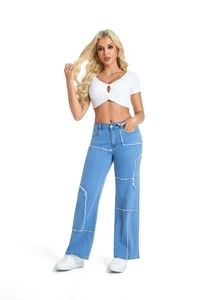 Full body view of high waist patchwork straight leg jeans with frayed seams on a model