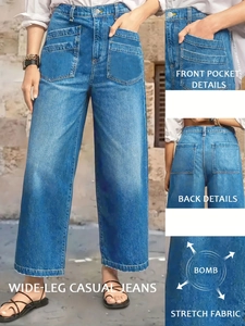 Detail of high waist stretch denim wide leg pants with front pocket and fabric stretch view