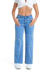 Detail of light blue wide-leg jeans with distressed patchwork and frayed raw edges