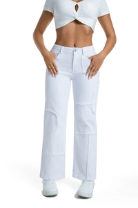 Detail of white wide-leg jeans with patchwork seams, raw edges, and loose fit