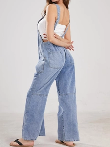 Side view of light blue wide-leg denim overalls with functional side cargo pockets