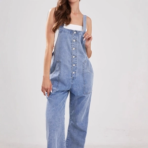 Women's light blue denim overalls with straight leg cut and front button detailing