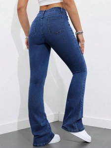 Slim fit high-waisted dark blue flare jeans with back pockets and a sleek silhouette