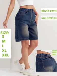 Detail of high-waist denim bicycle shorts with back elastic waistband and S-XXL size chart