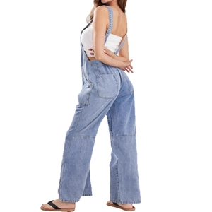Light blue denim overalls with wide-leg cut and crossover straps seen from a side-back view
