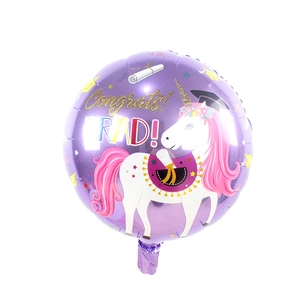 Detail of purple unicorn graduation foil balloon with Congrats Grad text for party decor