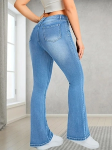 Rear view of light blue flare jeans with high waist design and faded wash finish