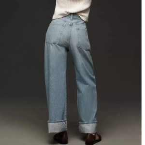 Light blue high waist wide leg jeans for women featuring stylish cuffed hems from back view
