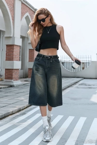 Street style shot of high waist wide leg denim capris in retro dark blue wash