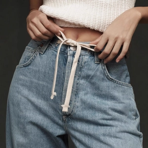 Light blue high waist wide leg jeans for women featuring white cotton drawstring cord