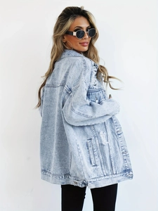 Distressed light blue oversized denim jacket for women with ripped details on back