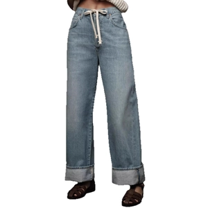 High waist light blue wide leg denim jeans with white drawstring cord and cuffed hems