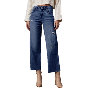 High-waist distressed wide-leg jeans in mid-blue with ripped details and frayed hems
