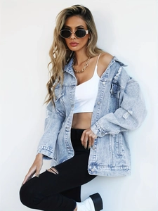 Light blue oversized distressed denim jacket with vintage ripped details and metal buttons
