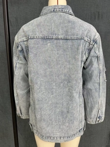 Rear view of light blue acid wash denim jacket showing back seams and distressed details