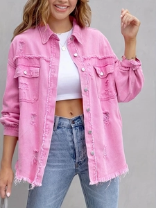 Detail of pink distressed denim jacket featuring frayed hem and metallic buttons