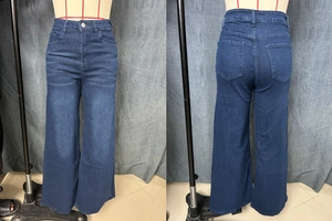 Detail view showing front and back of high waisted wide leg dark blue denim jeans