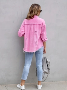 Detailed back view of distressed pink denim jacket featuring frayed hem and ripped accents