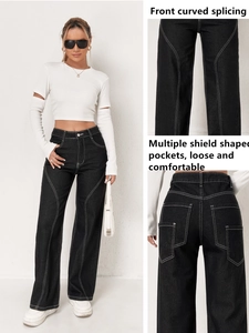 Detail of high-waist cargo jeans showing white contrast stitching and curved splicing