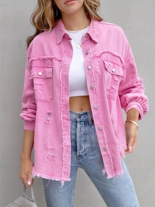 Detailed view of pink distressed denim jacket with frayed edges and metal buttons
