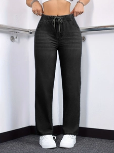 Detail of high waist charcoal denim straight pants with elastic drawstring waist design