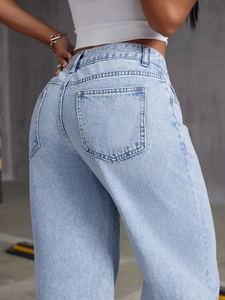 Detailed back view of light blue wide leg denim jeans with classic square pockets